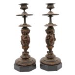 Pair of 19th century Continental bronze candlesticks with putti supports
