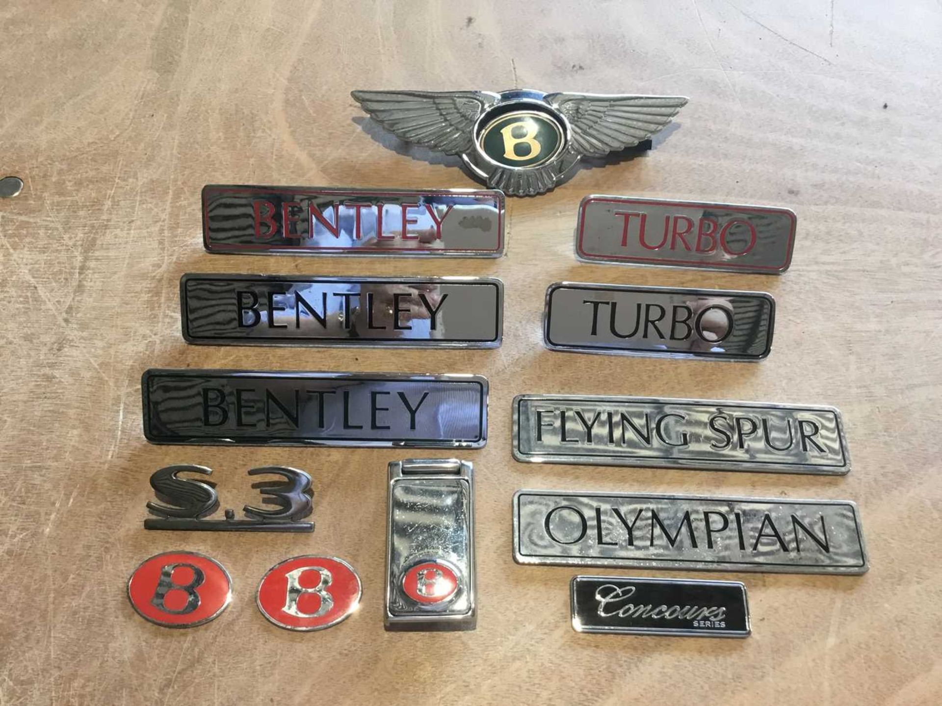 Collection of Bentley enamelled model name plates and boot badges (13)