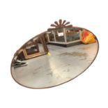 Oval bevelled wall mirror in copper frame, 76.5cm x 56cm