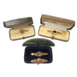 Four Late Victorian/ Edwardian 9ct gold gem set and seed pearl bar brooches, within three antique je