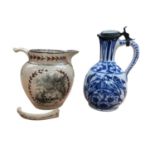 Early 19th century English pottery jug, and a delft jug