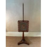 Regency rosewood pole screen, with rising embroidery banner, on platform base