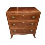 A small George III mahogany chest of three drawers with boxwood stringing, oval brass handles on spl