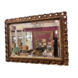 Antique wall mirror with pierced frame