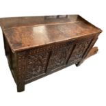 Antique oak coffer with carved panelled front, 125cm wide, 54cm deep, 75cm high