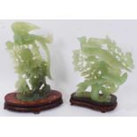 Chinese jade or green hardstone carving depicting phoenix, on carved and pierced hardwood stand, 34c