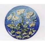 19th century pottery dish, painted with flowers on blue background, signed and dated 1882