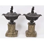 Pair of late 19th century bronzed lidded urns on faux marble bases