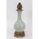 19th century French celadon porcelain lamp with brass mounts.