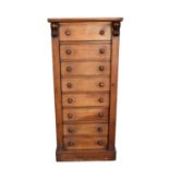 Early Victorian walnut Wellington chest, with bank of eight graduated drawers between locking stiles