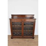 Edwardian limed mahogany and satin wood inlaid low bookcase by Maples & Co., with gallery back and e