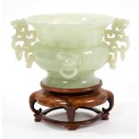Chinese carved green jade vase on wooden stand