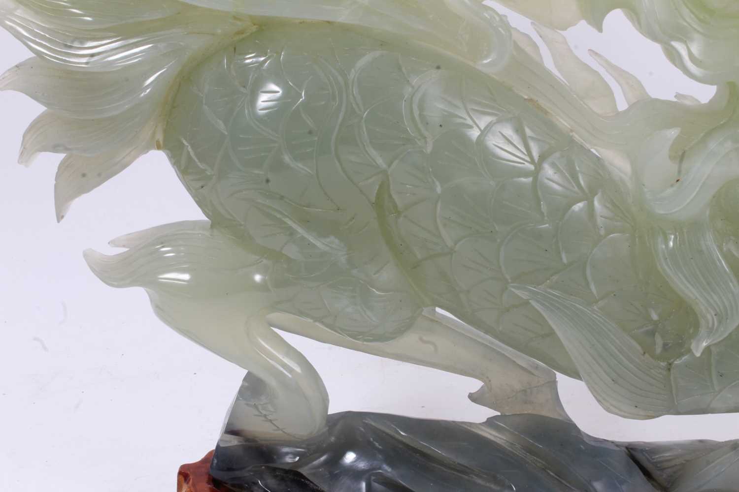 Large Chinese jade or green hardstone carving of a mythical beast, raised on wooden plinth, 43cm lon - Image 3 of 7