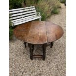 17th century oak drop leaf table, with oval hinged top on barley twist and block understructure, 132