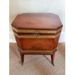 George III mahogany and brass bound wine cooler, of canted rectangular outline with flanking lion ma