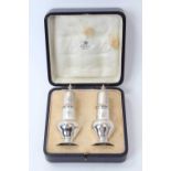 Pair of Asprey silver pepperettes in fitted case