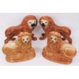 Two pairs of Victorian Staffordshire pottery lions