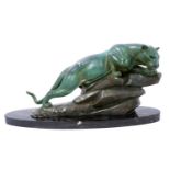 M. Leducq: A patinated spelter model of a panther crouched upon a rock, signed, on oval marble plint