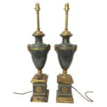 Pair of good quality table lamps of classical urn form with ram's head mounts, on stepped square ped