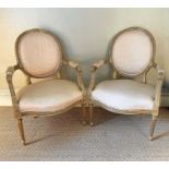 Pair of Louis XVI style giltwood fauteuils, each with carved gilt showwood frame and shot silk on fl