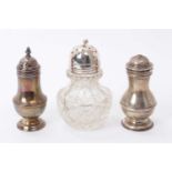 George II silver caster of baluster form with pierced domed cover (London 1735) and two others