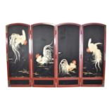 Japanese Meiji period red lacquered and silk embroidered four fold screen, with depictions of cocker