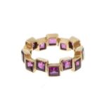 Amethyst and gold eternity ring
