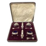 Six piece silver condiment set in fitted case
