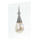 A single pearl and diamond earring with a pear shape pearl (not tested for natural origin) measuring