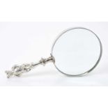 Magnifying glass with late Edwardian silver handle, in the form of a double sided bear
