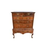 18th century walnut chest of two short and three long drawers, on later base with cabriole legs