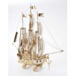 Contemporary continental parcel gilt model of a galleon on wheels, London import marks