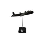 Carved and painted model of a Second World War Short Sterling bomber on plinth base, 43cm high