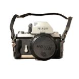 Nikon F SLR camera in leather case, serial number 7081404, circa Feb-April 1970.