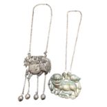 Two old Chinese white metal necklaces, one with a pierced and embossed plaque depicting a figure on