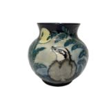 Moorcroft pottery limited edition vase decorated with badgers in foliage, no.40 of 50, signed Sian L