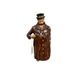 Royal Doulton Kingsware miniature figural whisky jug, Coachman, modelled as a man with hand in pocke