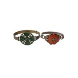Chinese white metal bangle set with five carved green jade/ hard stone discs, together with a simila