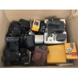 Large quantity of cameras, including Polaroid, Kodak, etc