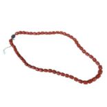 Old Chinese coral necklace with barrel shaped polished beads and oval silver gilt clasp with wire wo