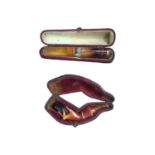 Cased cheroot holder with amber mouthpiece, and a cased meerschaum pipe in the form of a hand (2)