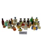 Large collection of vintage scent bottles, many with contents, including Chanel, Dior, etc
