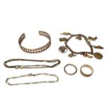 Group of 9ct gold jewellery to include a torque bangle, a gold charm bracelet, two wedding rings, br