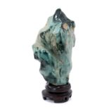 Chinese malachite scholar's rock on wooden stand