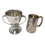 1930s silver two handled cup with flared rim and a silver glass bottom tankard,