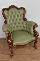 Victorian style leather upholstered tub armchair, with carved show wood frame