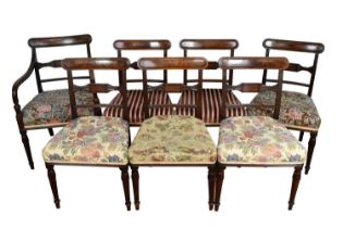 Set of seven Regency mahogany and ebony inlaid dining chairs, including one carver
