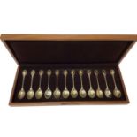 Cased set of twelve RSPB silver teaspoons, with silver gilt terminals
