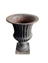 Pair of antique black painted cast iron urns, of campana fluted form, raised on square plinths, 79cm