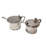 Two silver mustard pots and a pair of silver plated condiment spoons